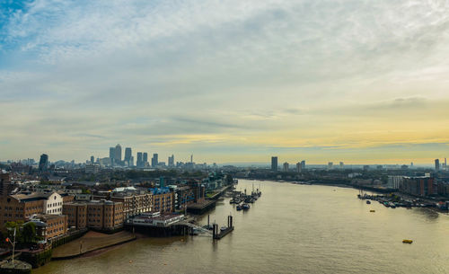 High angle view of river by buildings against sky