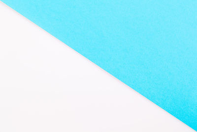 High angle view of blue paper on white background