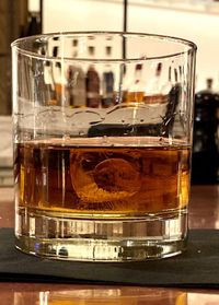 Close-up of beer glass on table