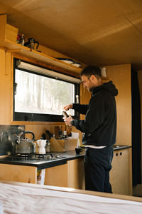 Portrait of young man standing in gym