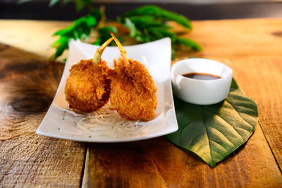 Close-up of food served on table