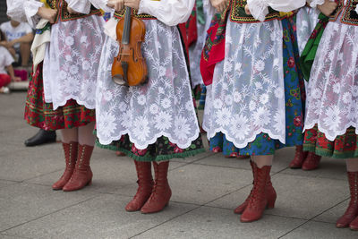 Low section of women standing on stage