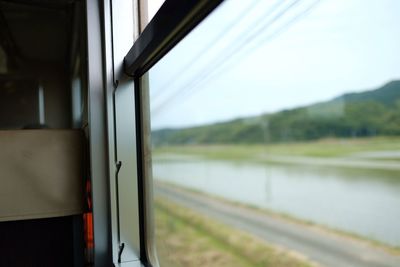 Close-up of train against sky