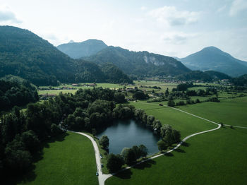 Scenic view of landscape and mountains against sky