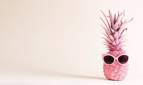 Close-up of potted plant on table against white background