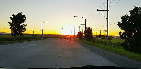 Empty road at sunset