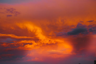 Low angle view of dramatic sky during sunset