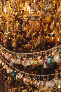 Close-up of decorations hanging in store for sale