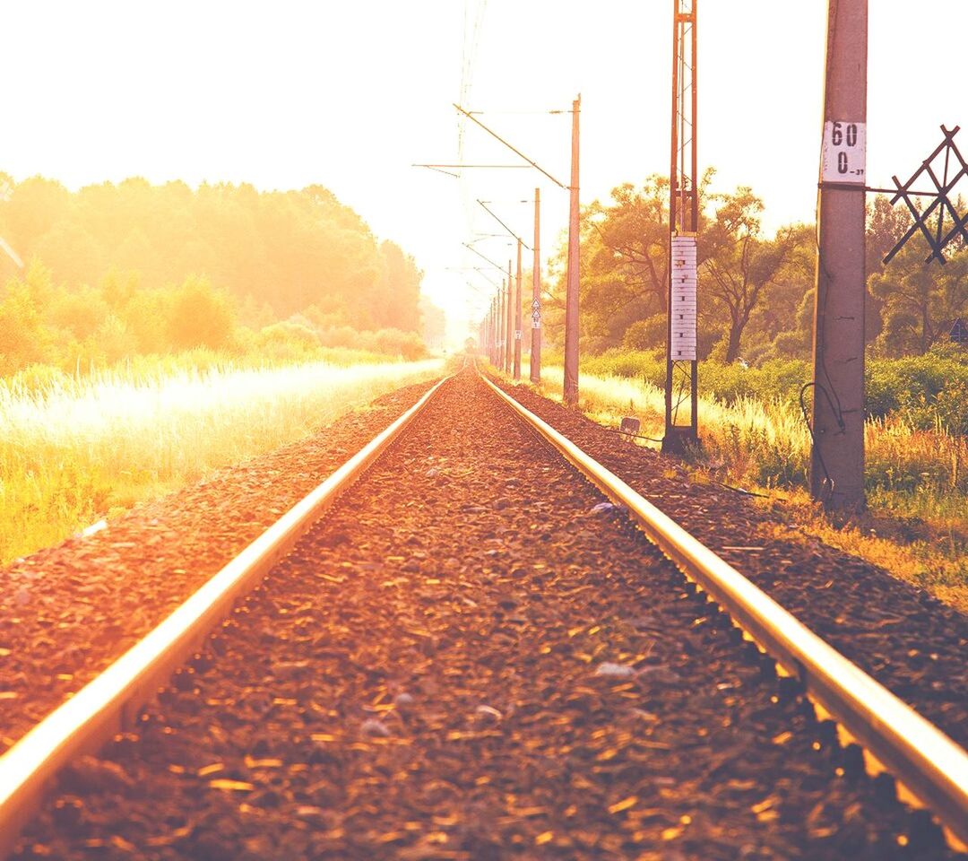 the way forward, railroad track, transportation, diminishing perspective, vanishing point, tree, rail transportation, clear sky, tranquility, sky, connection, landscape, nature, tranquil scene, straight, long, surface level, outdoors, road, no people