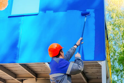 Rear view of man working at construction site