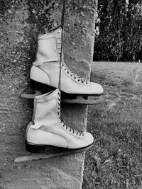 Low section of shoes on field