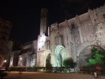 Low angle view of illuminated building at night