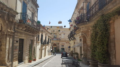 Narrow alley amidst buildings in city