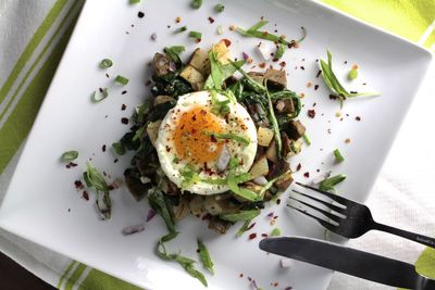 Directly above view of potato with poached egg served in plate