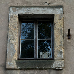 Low angle view of window on old building