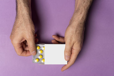 Cropped hand of person holding jigsaw piece