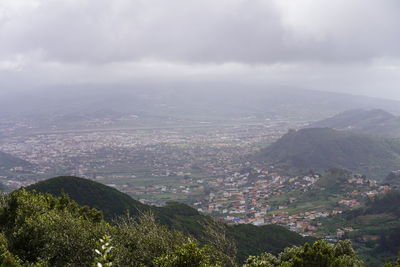 Aerial view of landscape and mountains against sky