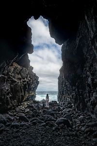 Rocks on beach against sky