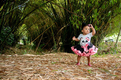 Portrait of a girl standing on tree