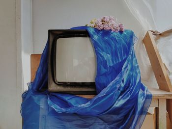 Close-up of blue glass window on wall