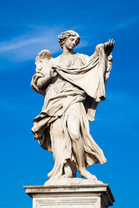 Low angle view of statue against sky