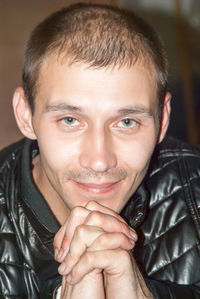 Close-up portrait of smiling man at home