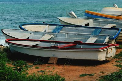 Close-up of boats moored at shore