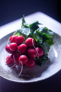 High angle view of strawberries in plate on table