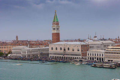 View of buildings in city against sky