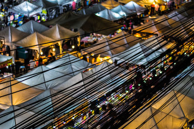 High angle view of illuminated tents at night