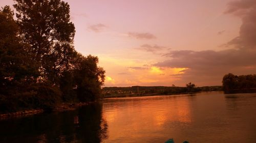 Scenic view of silhouette trees against sky at sunset