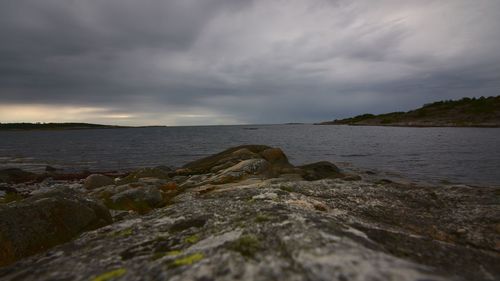 Scenic view of sea against cloudy sky