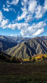Aerial view of landscape against cloudy sky