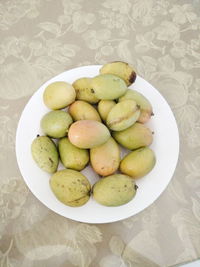 Close-up of fruits in plate on table