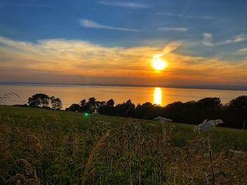 Scenic view of sea against sky during sunset