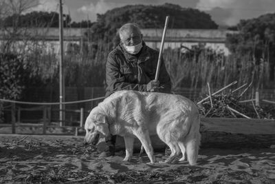 Full length of man with dog