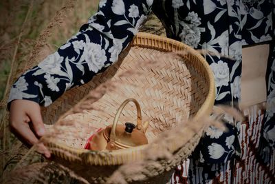 Close-up of woman holding basket