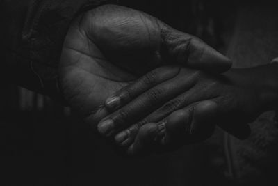 Close-up of people holding hands