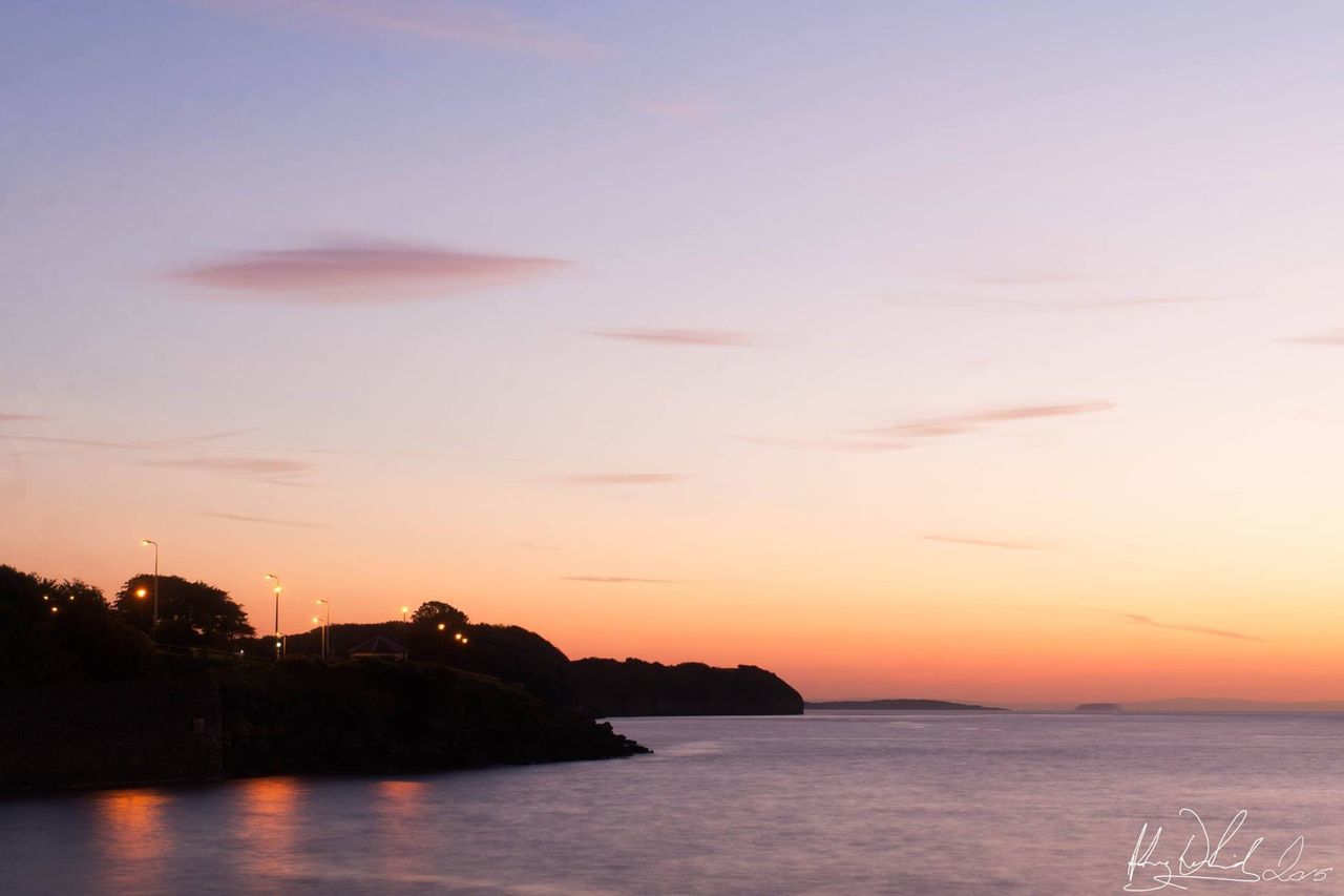 SCENIC VIEW OF SUNSET OVER SEA