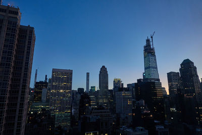 View of buildings in city of new york at dawn 