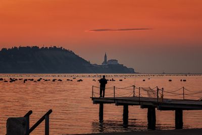 Silhouette of people at sunset