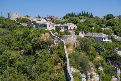 High angle view of trees and buildings against sky