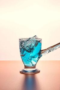 Close-up of drink over white background