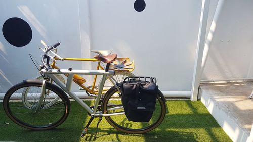 Bicycle parked against wall