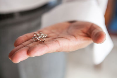 Close-up of couple holding hands