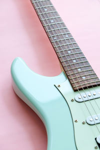 Close-up of guitar against black background