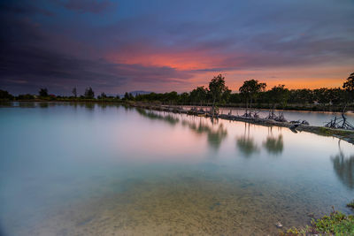 Scenic view of lake against sky during sunset