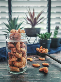 Close-up of fruits in glass jar on table