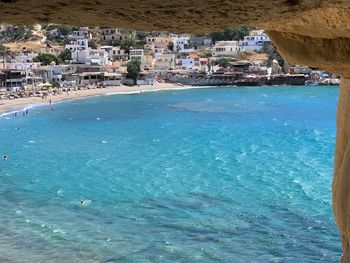 High angle view of sea and buildings