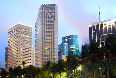 Low angle view of modern buildings against sky in city